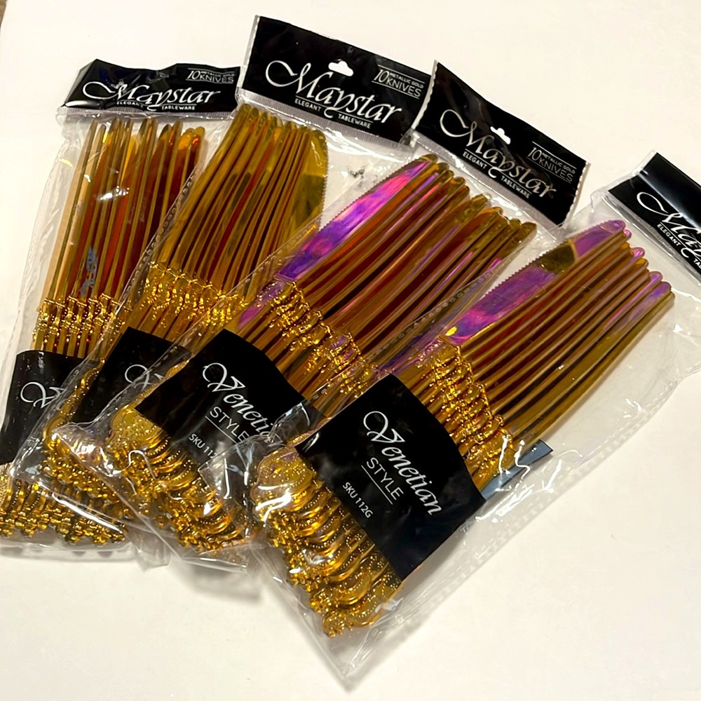 Pack of 4 golden flatware new in bag never used